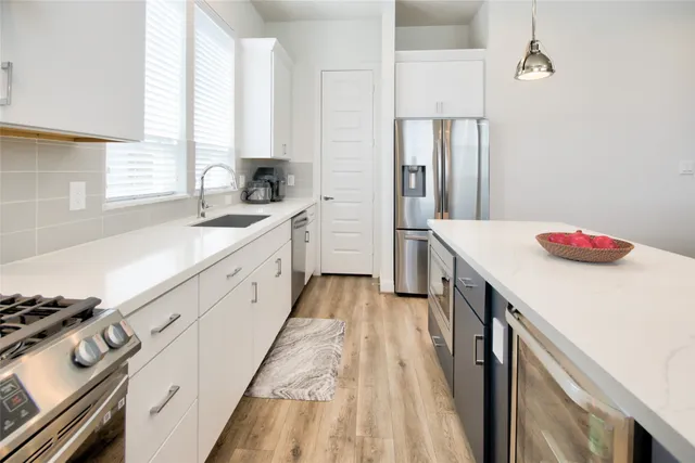 a view of a livingroom with furniture and a flat screen tv