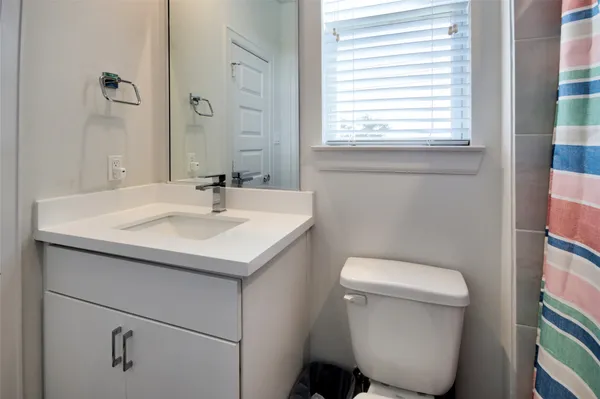 a bedroom with a bed and a walk in closet