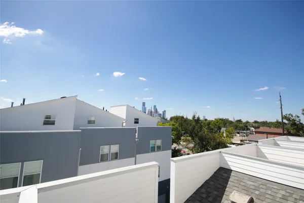 a view of a balcony with furniture