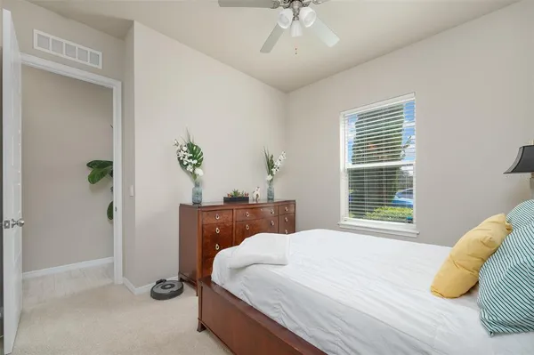 a view of a livingroom with furniture and a ceiling fan