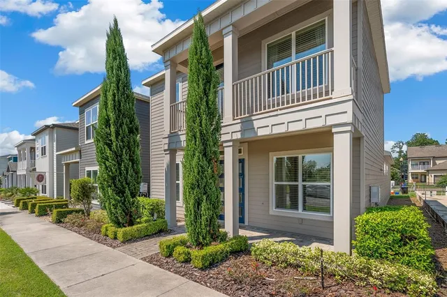 a front view of a house with garden