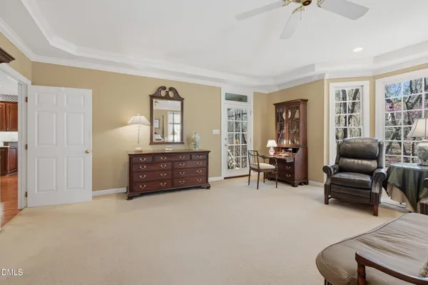 a living room with furniture and a dining table