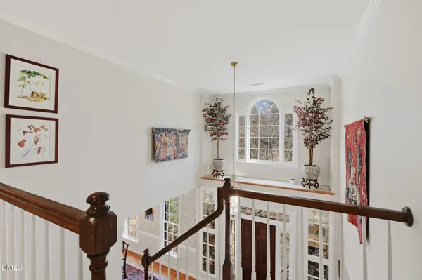 a view of a hallway with windows