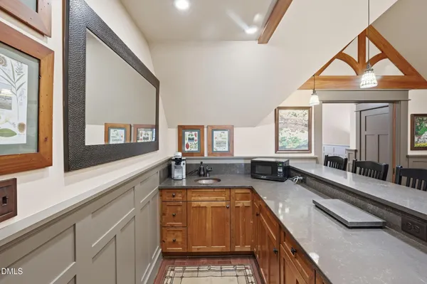a spacious bathroom with a granite countertop tub and a large window