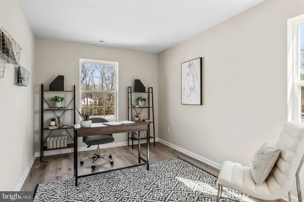 a workspace with furniture and a window