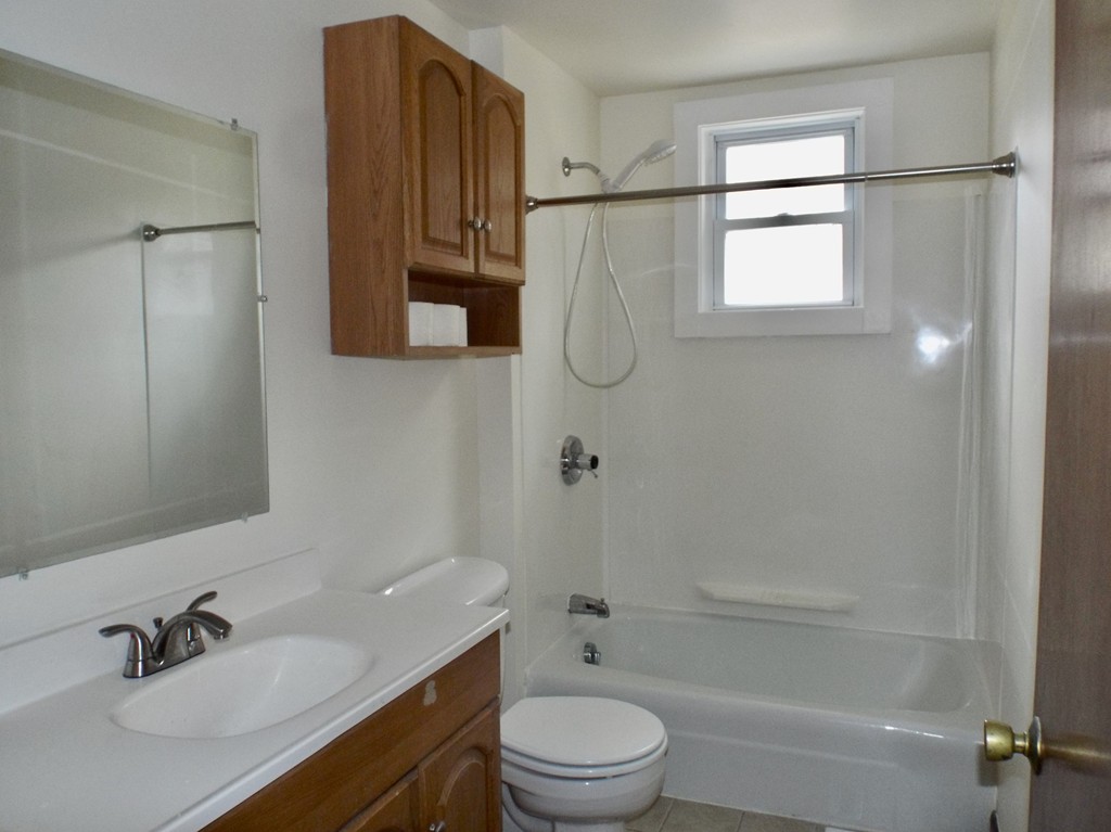 13 Church Street Colrain, MA 01340 - Photo 11 of 36 a bathroom with a sink toilet a mirror and shower