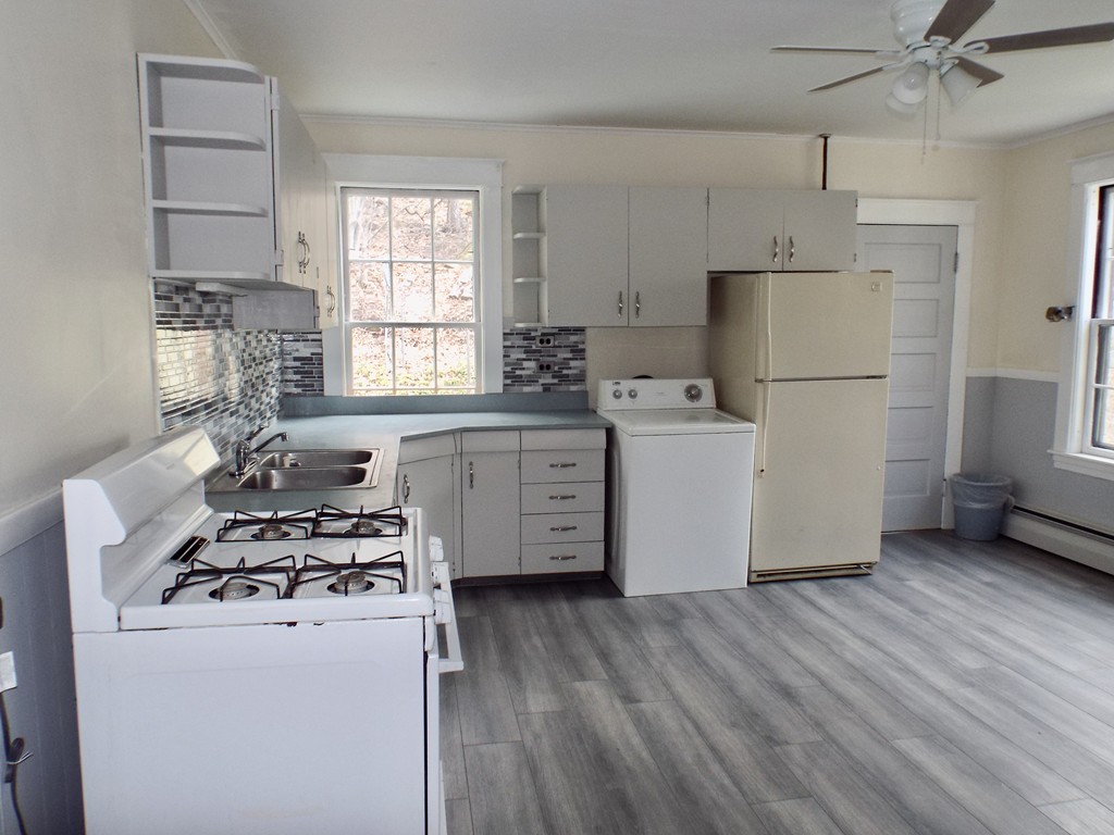 13 Church Street Colrain, MA 01340 - Photo 15 of 36 a kitchen with a stove a refrigerator and a stove