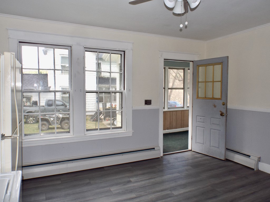 13 Church Street Colrain, MA 01340 - Photo 18 of 36 an empty room with wooden floor and windows