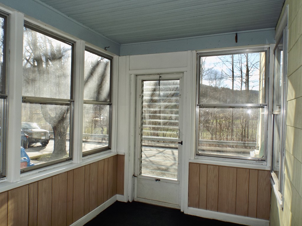 13 Church Street Colrain, MA 01340 - Photo 20 of 36 a view of an empty room with a window