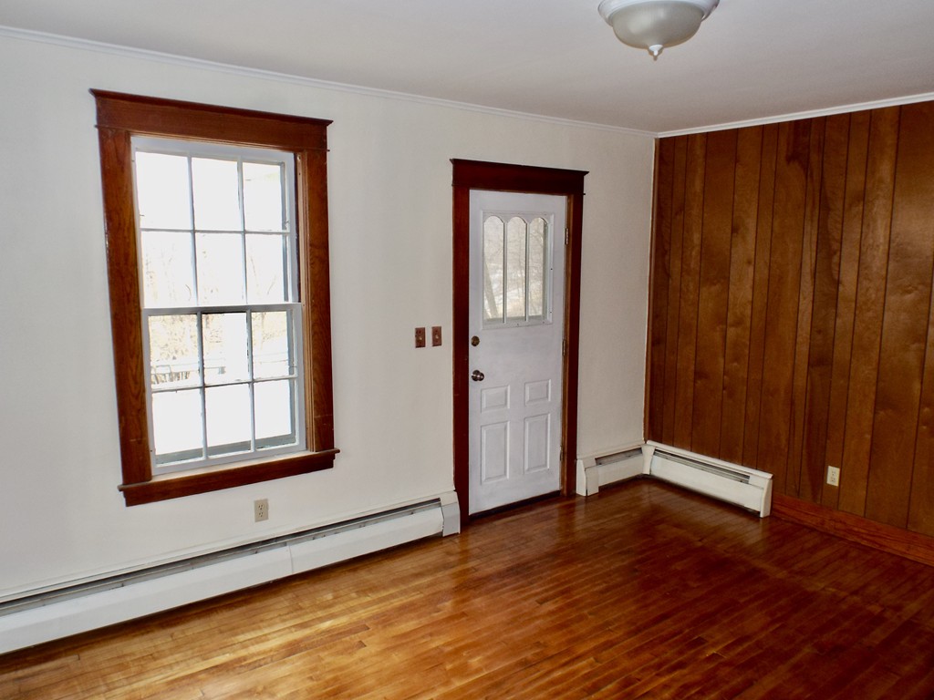 13 Church Street Colrain, MA 01340 - Photo 21 of 36 an empty room with wooden floor and windows