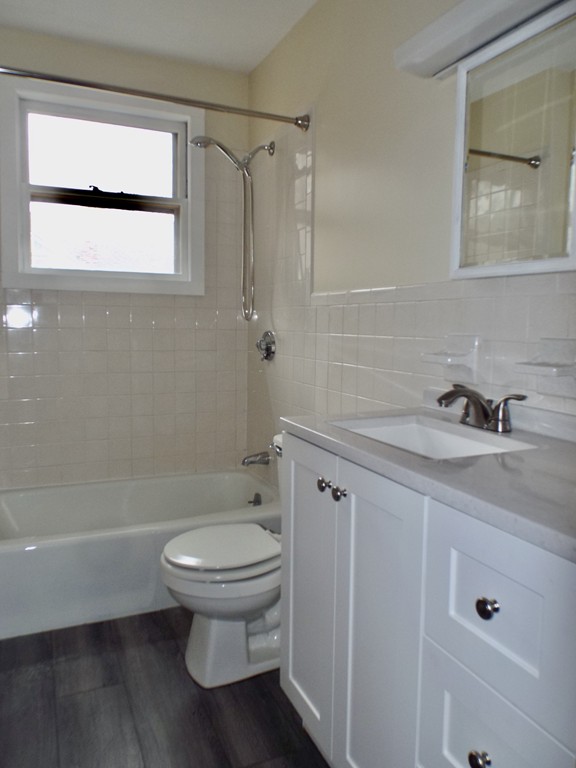 13 Church Street Colrain, MA 01340 - Photo 24 of 36 a bathroom with a granite countertop toilet a sink and a bathtub