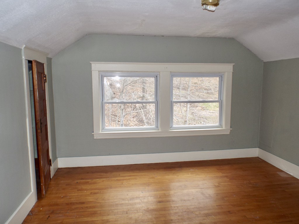 13 Church Street Colrain, MA 01340 - Photo 28 of 36 a view of an empty room with wooden floor and a window