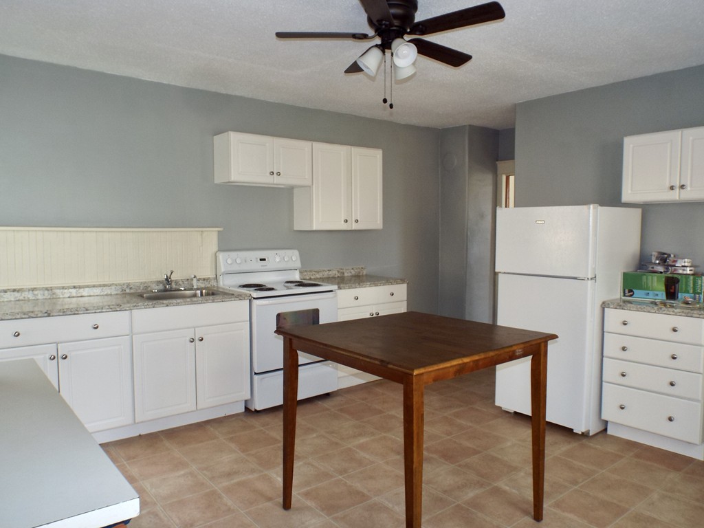13 Church Street Colrain, MA 01340 - Photo 3 of 36 a kitchen that has a cabinets and a refrigerator