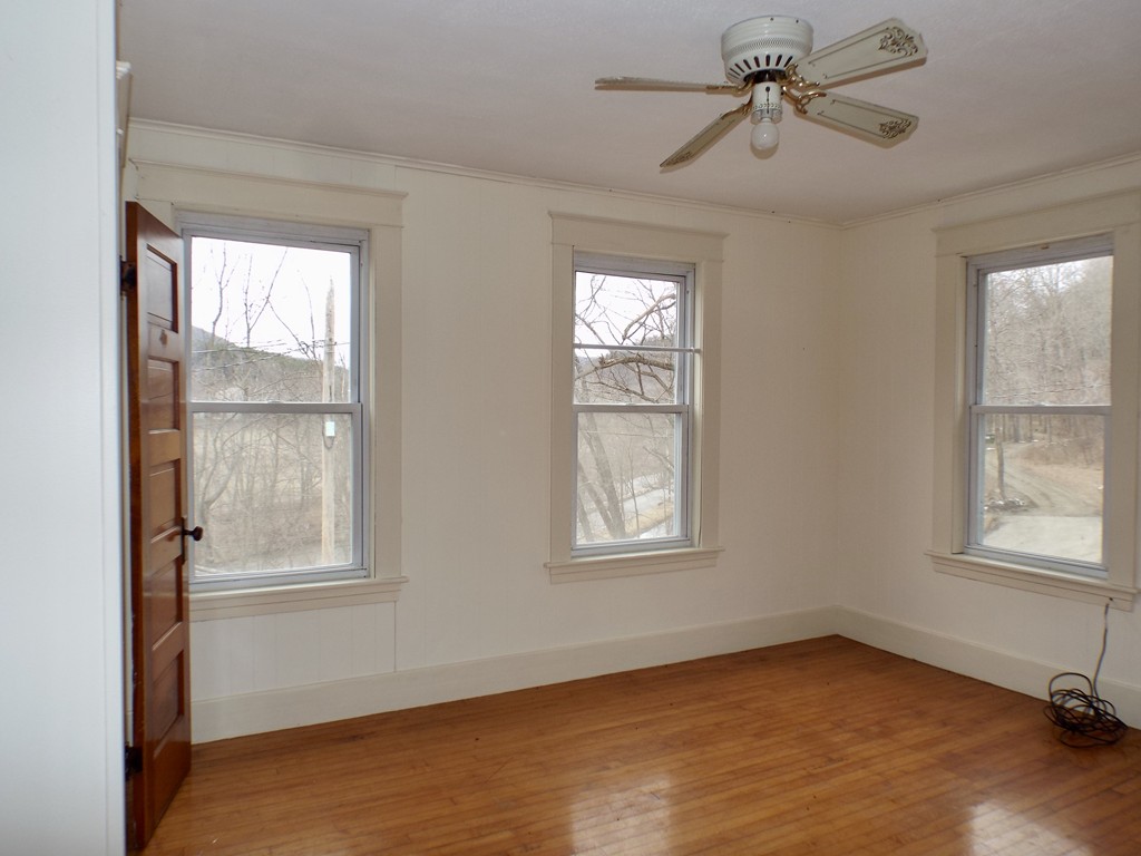 13 Church Street Colrain, MA 01340 - Photo 8 of 36 a view of an empty room with a window