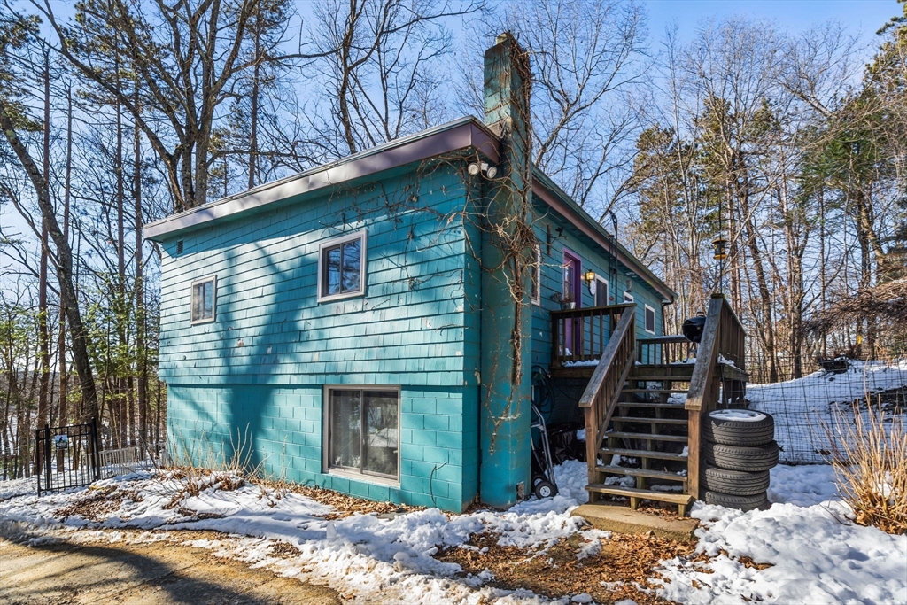 104 Island Road Lunenburg, MA 01462 - Photo 1 of 35 a front view of a house with wooden fence