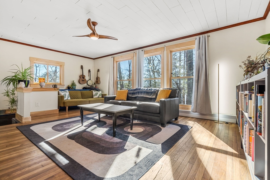 104 Island Road Lunenburg, MA 01462 - Photo 11 of 35 a living room with furniture a rug and a large window