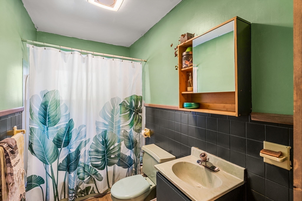 104 Island Road Lunenburg, MA 01462 - Photo 16 of 35 a bathroom with a toilet sink and mirror