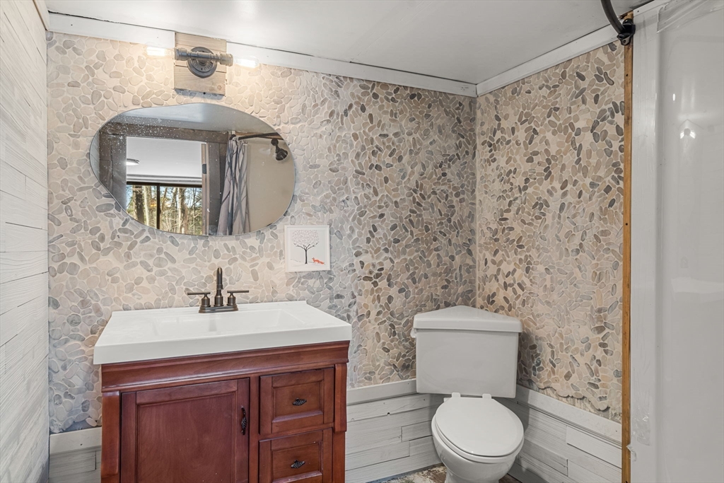104 Island Road Lunenburg, MA 01462 - Photo 24 of 35 a bathroom with a toilet a sink and a mirror