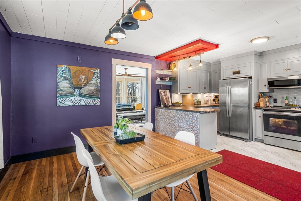 104 Island Road Lunenburg, MA 01462 - Photo 8 of 35 a dining room with furniture and a kitchen view