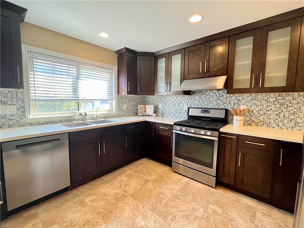 28115 Ridgepoint Court Rancho Palos Verdes, CA 90275 - Photo 15 of 31 a kitchen with stainless steel appliances granite countertop a stove sink and cabinets