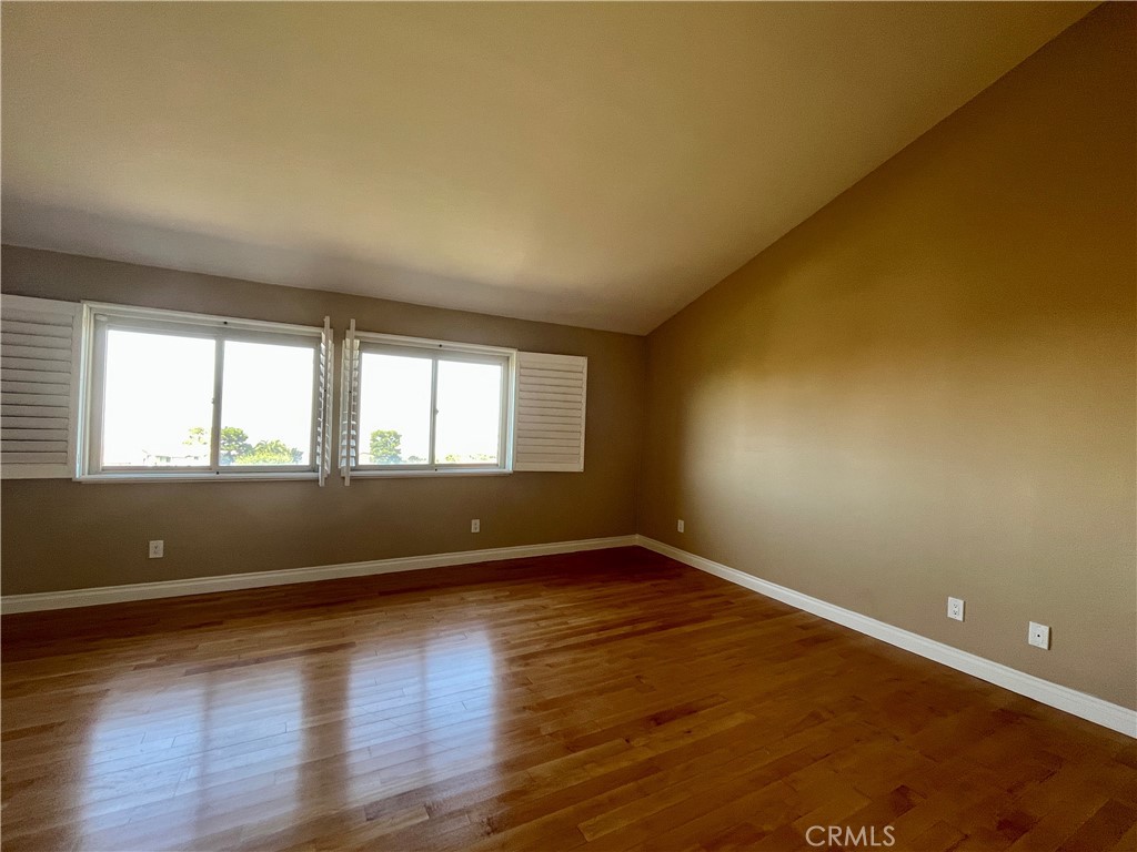 28115 Ridgepoint Court Rancho Palos Verdes, CA 90275 - Photo 17 of 31 a view of an empty room with wooden floor and a window