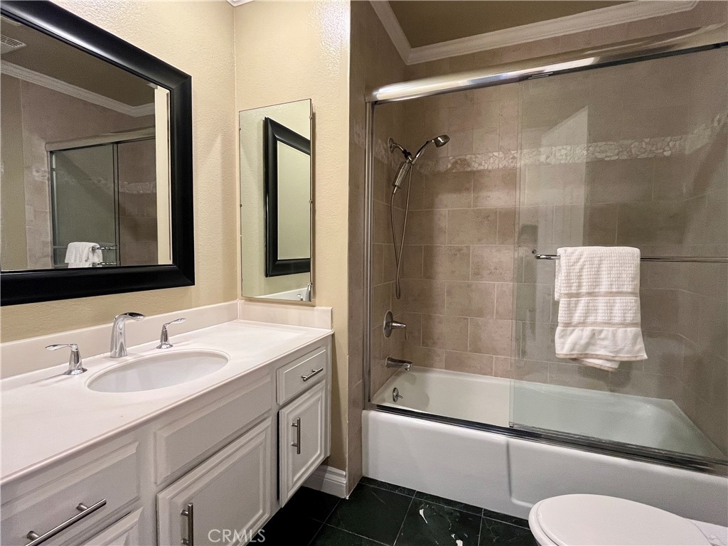 28115 Ridgepoint Court Rancho Palos Verdes, CA 90275 - Photo 22 of 31 a bathroom with a granite countertop sink toilet and shower