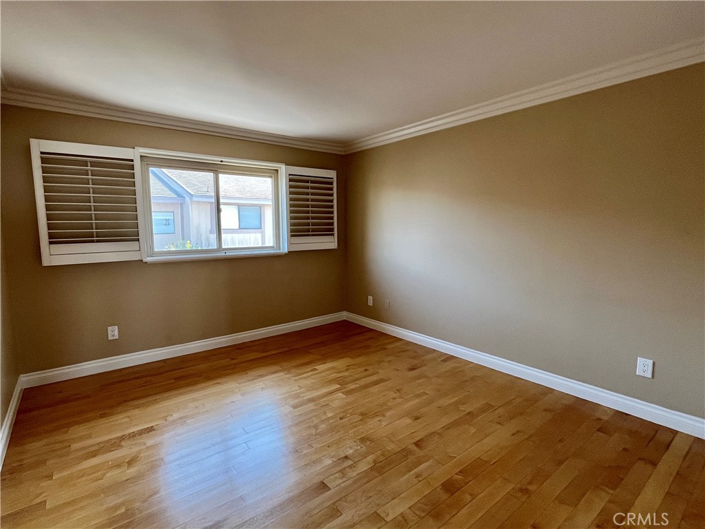 28115 Ridgepoint Court Rancho Palos Verdes, CA 90275 - Photo 23 of 31 a view of an empty room with wooden floor and a window