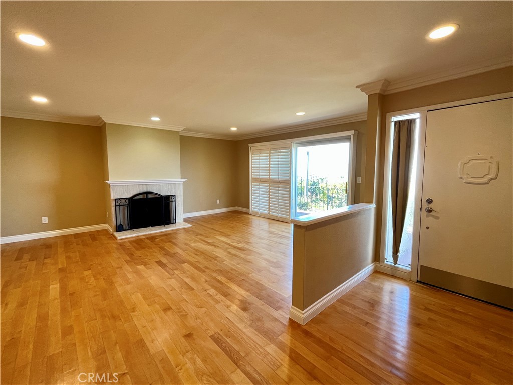 28115 Ridgepoint Court Rancho Palos Verdes, CA 90275 - Photo 7 of 31 a view of an empty room with wooden floor and a window