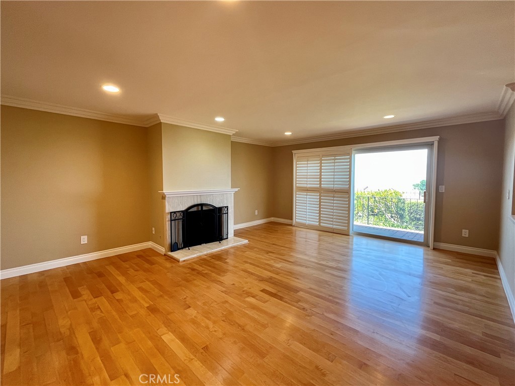 28115 Ridgepoint Court Rancho Palos Verdes, CA 90275 - Photo 8 of 31 a view of a room with wooden floor and a fireplace
