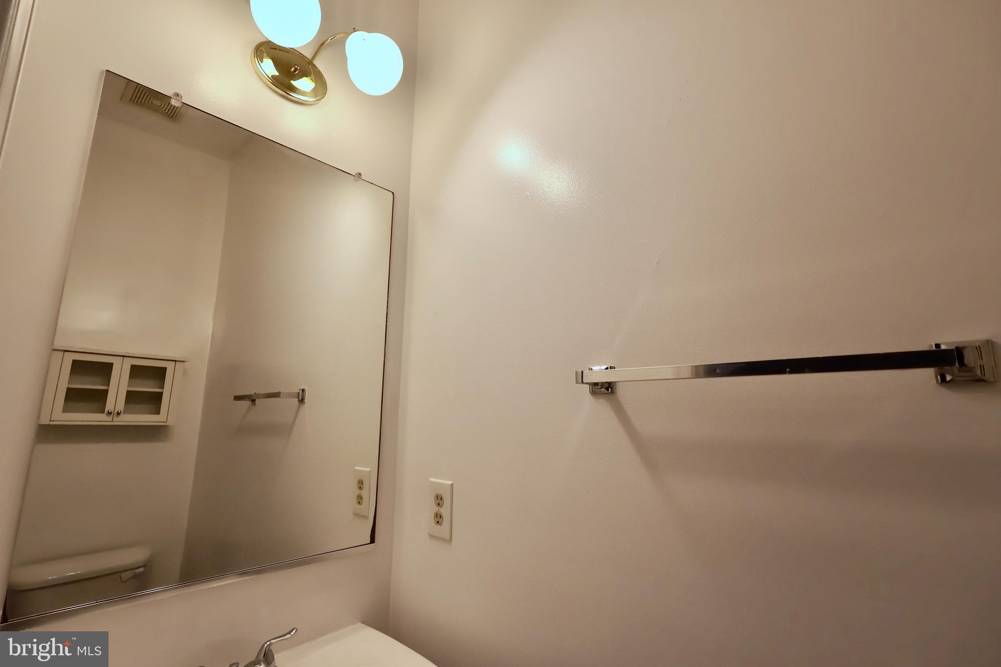 303 Three Sirens Odenton, MD 21113 - Photo 12 of 24 a bathroom with a shower and a toilet