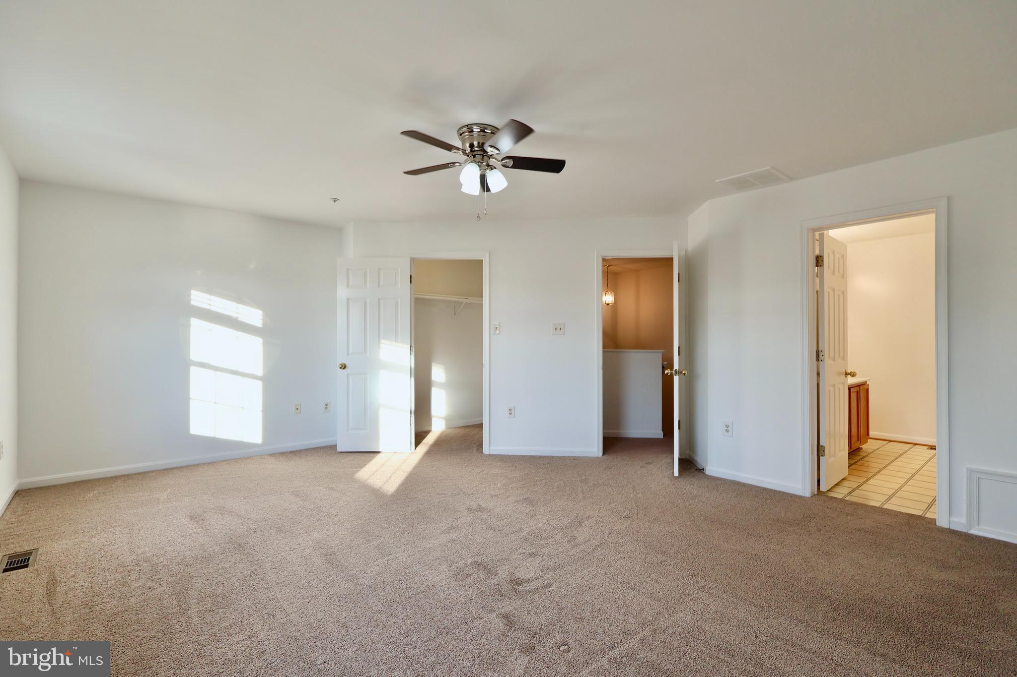 303 Three Sirens Odenton, MD 21113 - Photo 15 of 24 a view of empty room with ceiling fan