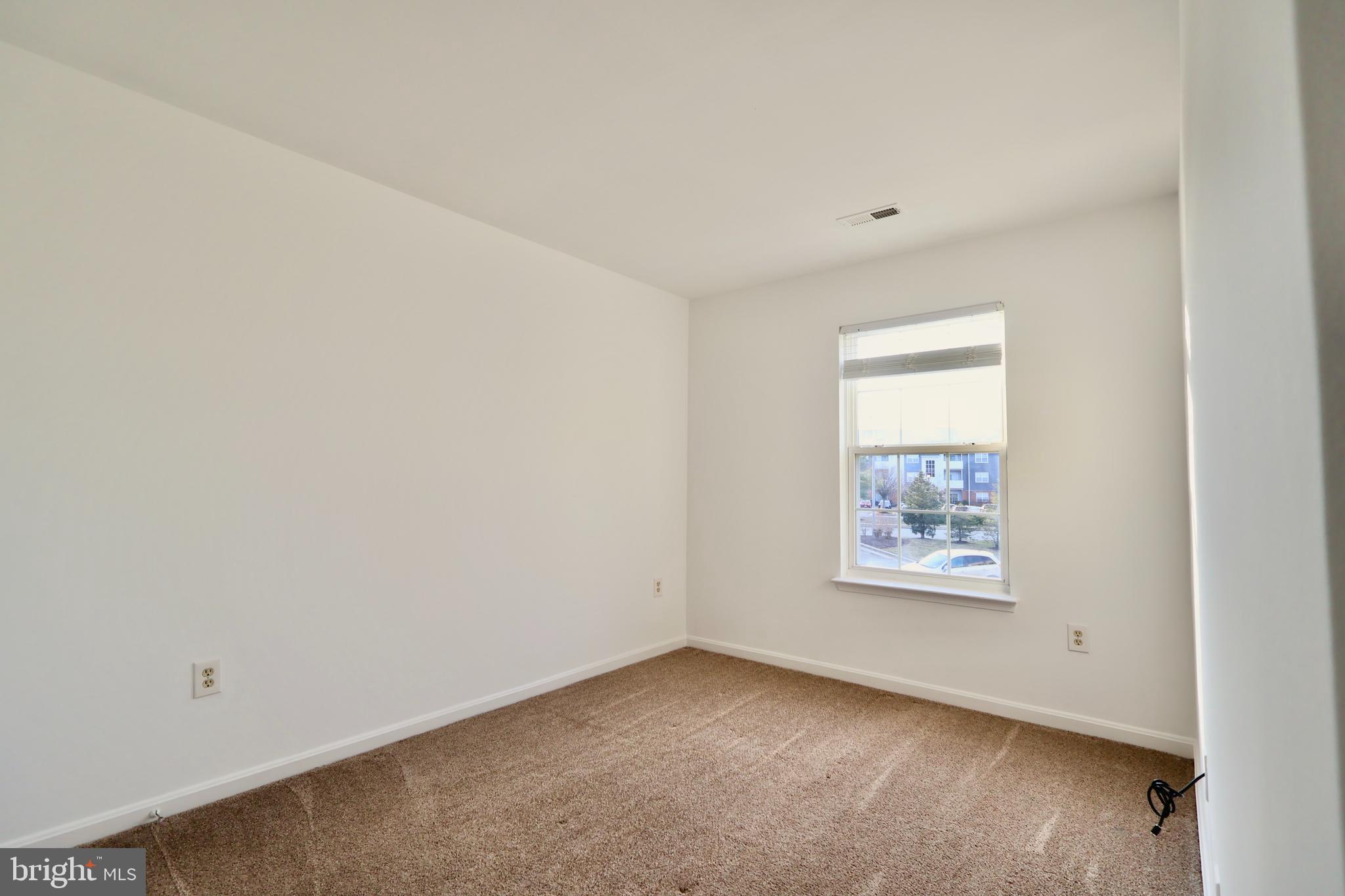 303 Three Sirens Odenton, MD 21113 - Photo 20 of 24 an empty room with windows