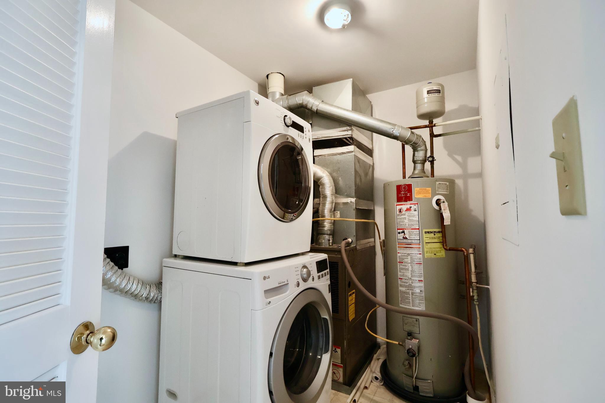 303 Three Sirens Odenton, MD 21113 - Photo 23 of 24 a utility room with dryer and washer