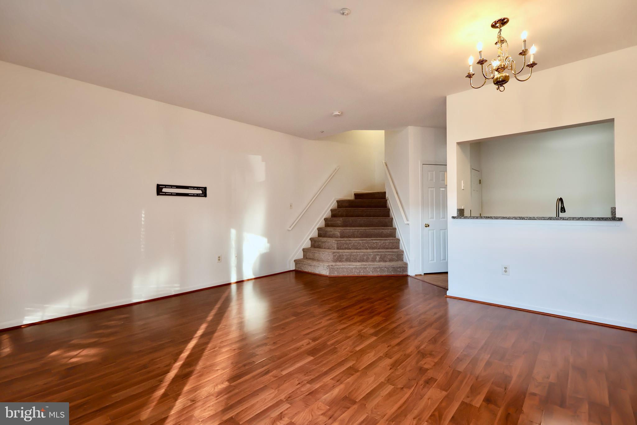 303 Three Sirens Odenton, MD 21113 - Photo 5 of 24 a view of a room with wooden floor