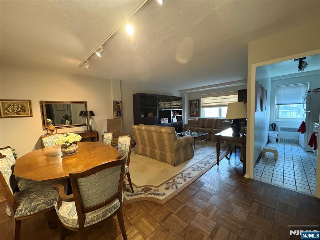 280 Prospect Avenue, Unit 5D Hackensack, NJ 07601 - Photo 11 of 21 a living room with furniture and a flat screen tv