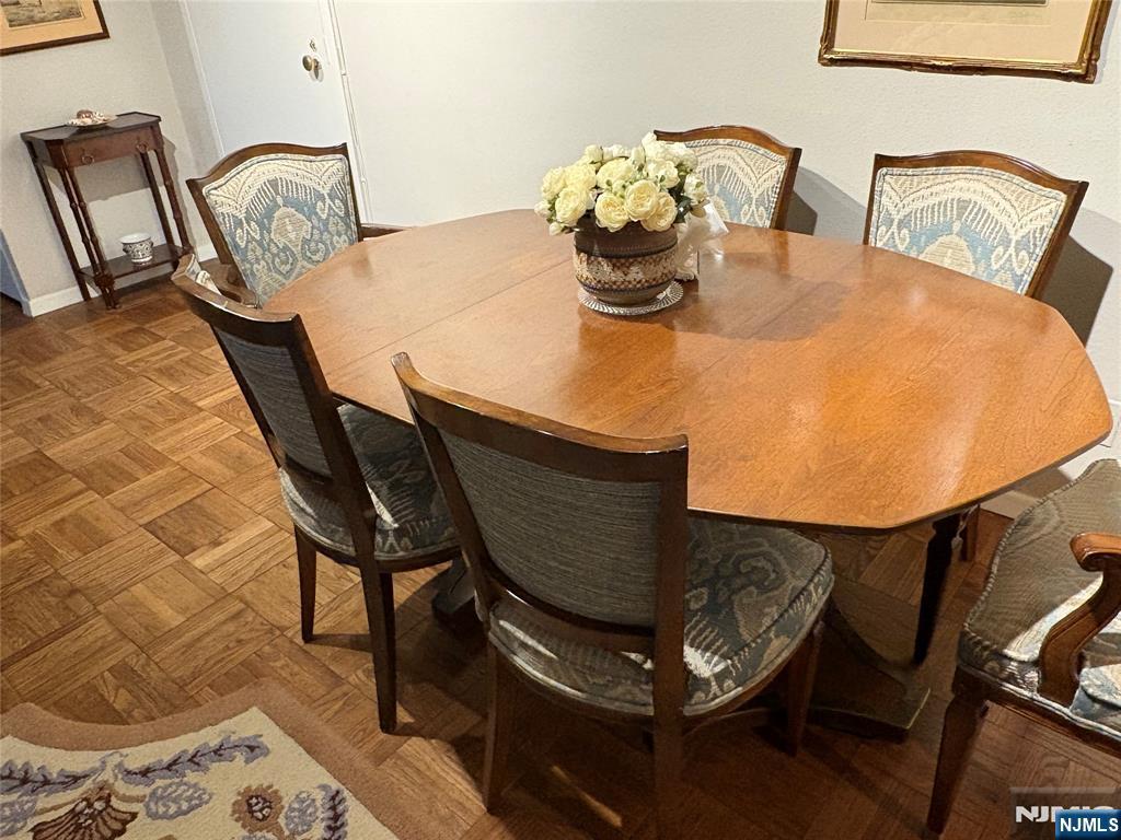 280 Prospect Avenue, Unit 5D Hackensack, NJ 07601 - Photo 12 of 21 a dining room with furniture and wooden floor