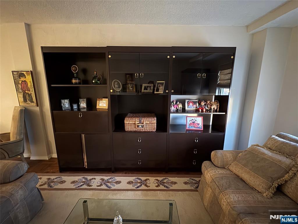 280 Prospect Avenue, Unit 5D Hackensack, NJ 07601 - Photo 16 of 21 a living room with furniture and a fireplace