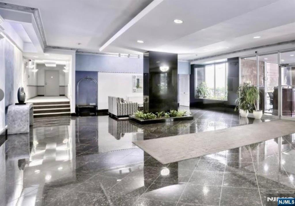 280 Prospect Avenue, Unit 5D Hackensack, NJ 07601 - Photo 4 of 21 a view of a lobby with a couch and a potted plant
