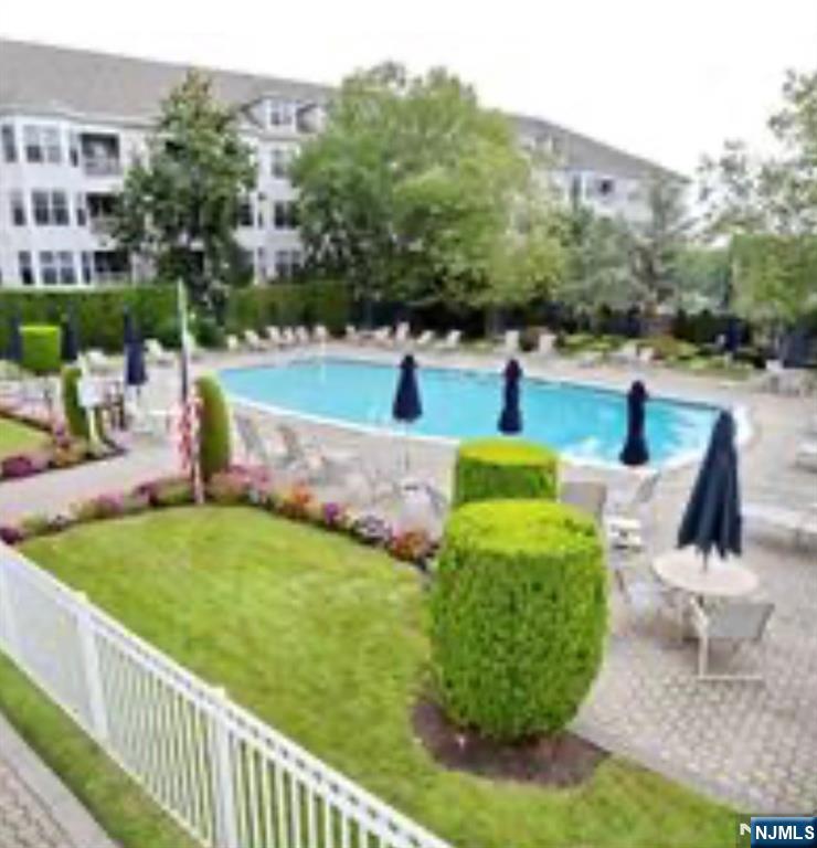 280 Prospect Avenue, Unit 5D Hackensack, NJ 07601 - Photo 6 of 21 a view of a garden with swimming pool