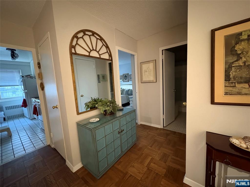 280 Prospect Avenue, Unit 5D Hackensack, NJ 07601 - Photo 10 of 21 a living room with furniture and a wooden floor