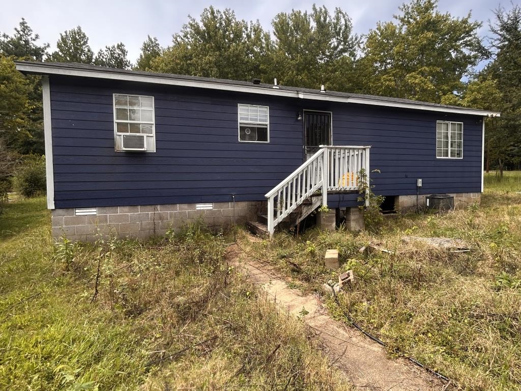 210 Griffin Road Mason, TN 38049 - Photo 2 of 13 a backyard of a house with lots of green space