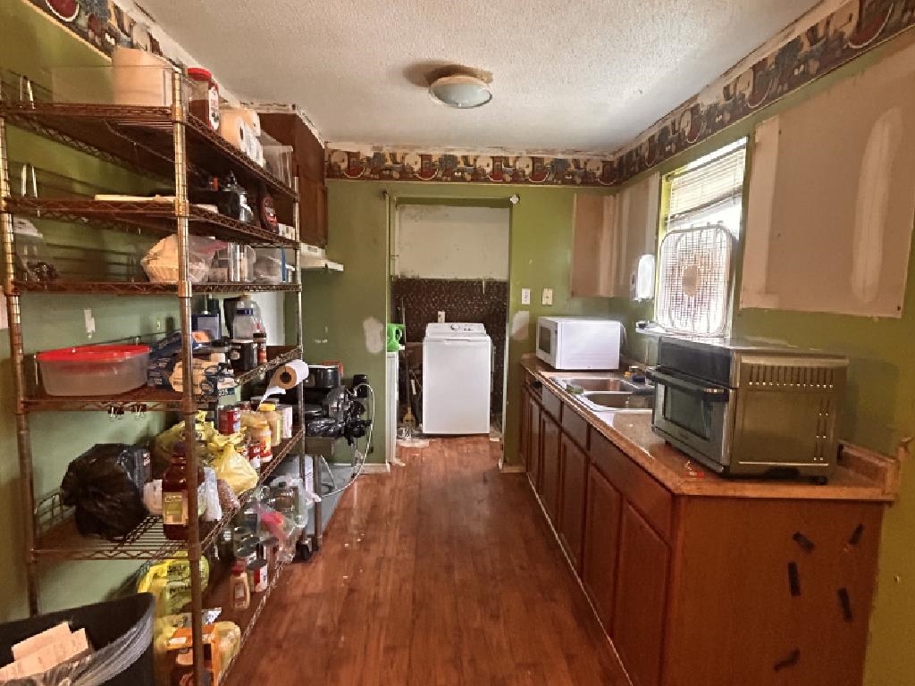 210 Griffin Road Mason, TN 38049 - Photo 5 of 13 a kitchen with wooden cabinets and stainless steel appliances