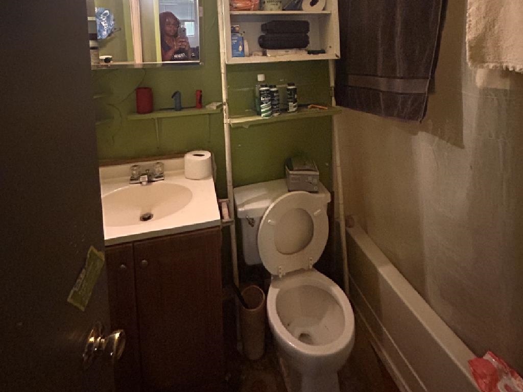 210 Griffin Road Mason, TN 38049 - Photo 8 of 13 a bathroom with a toilet and a sink