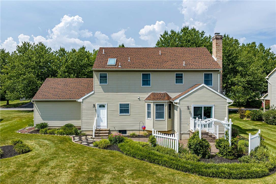 4568 Greenfield Road Bethlehem, PA 18017 - Photo 39 of 59 A private yard with abundant foliage and a welcoming patio offers outdoor tranquility.
