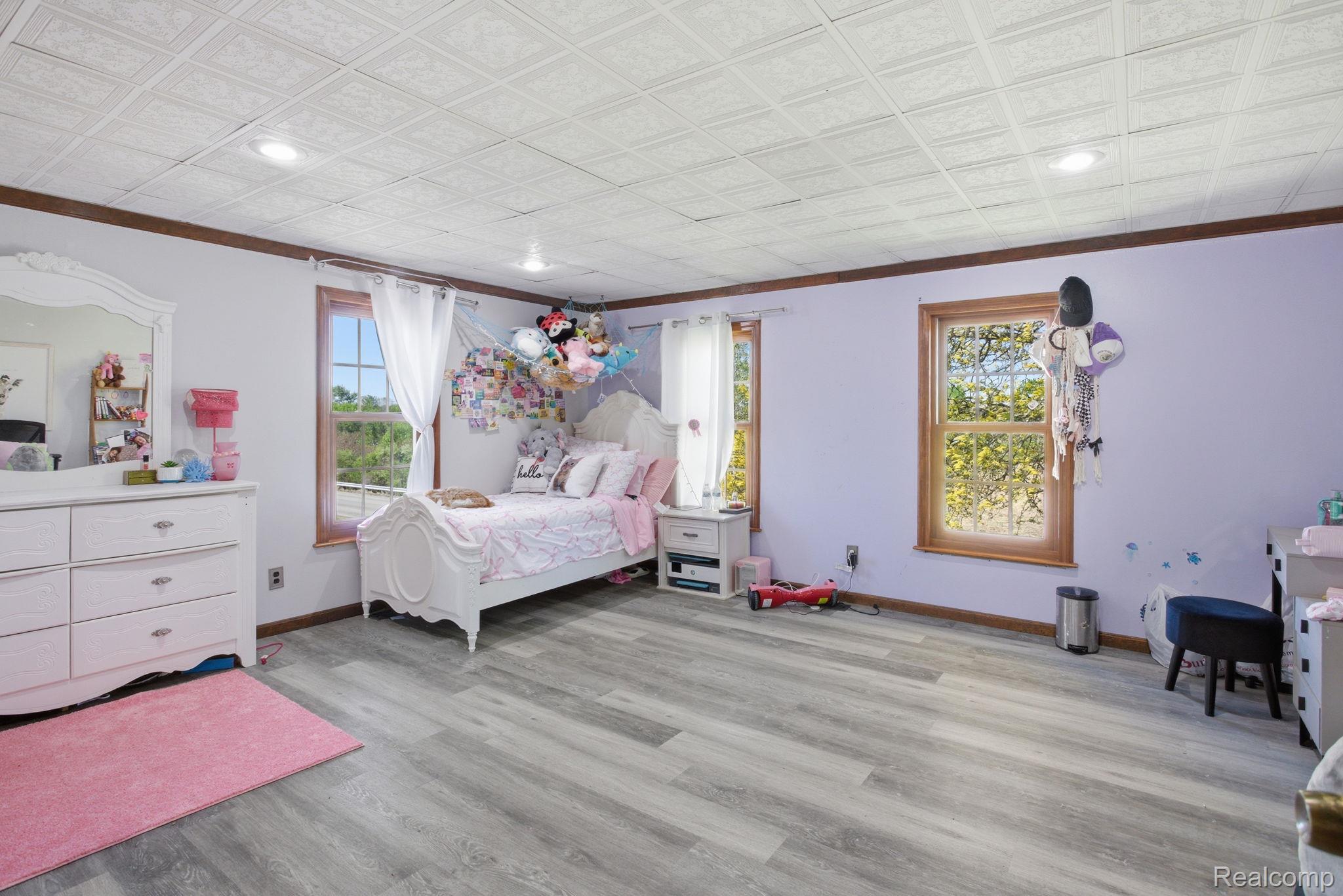 14104 Carleton West Road Carleton, MI 48117 - Photo 33 of 58 Bedroom featuring ornamental molding, recessed lighting, light wood finished floors, and an ornate ceiling
