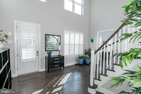 a view of entryway with livingroom and stairs