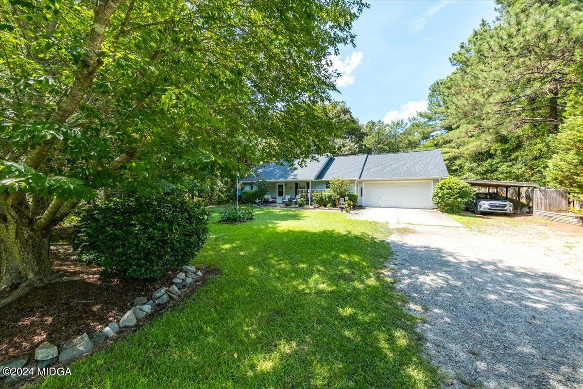 1426 Teagle Road Forsyth, GA 31029 - Photo 3 of 27 a view of a house with a backyard