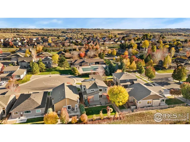an aerial view of residential building and ocean