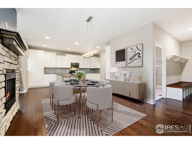 a living room with dining room and wooden floor