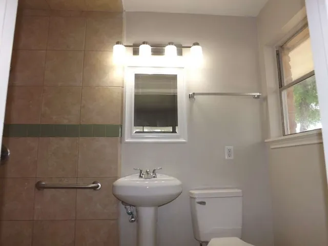 a bathroom with a sink and mirror